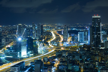 Fototapeta na wymiar Tel Aviv Skyline At Night, Skyscraper and Ayalon Freeway