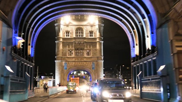  Smooth driving through night traffic on Tower Bridge (iconic symbol of London), London, United Kingdom 