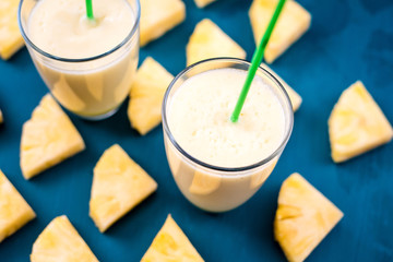 pineapple smoothie on a blue background