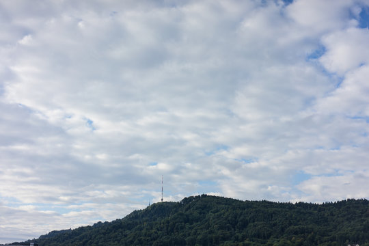 uetliberg mountain in zurich switzerland with tv tower and cloudy sky