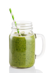 Smoothies of avocado, banana, citrus and spinach leaves isolated on white background