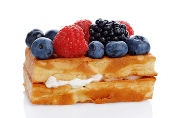 Viennese waffles with fresh blueberries, blackberries and raspberries isolated on white background