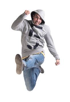 Funny cheerful happy man jumping in air over white background