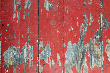 Texture of old dilapidated wooden floor with red peeling paint. Exfoliated Paint on an Old Wooden...