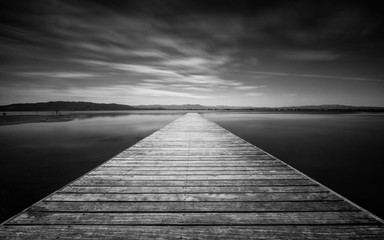 Fototapeta premium Bridge of El Trabucador beach in Delta Ebro ,Spain.Long exposure