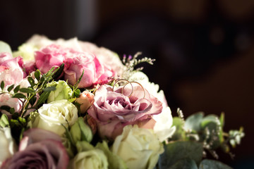 wedding rings lie on a beautiful wedding bouquet, wedding rings lie on a roses, bridal accessories, European Wedding, American Wedding