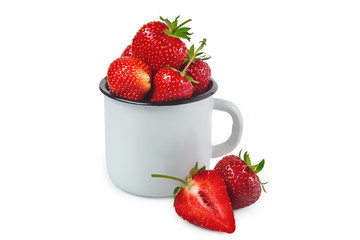 Ripe strawberries in enamel mug isolated on white