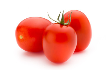 Small plum tomatoes on a white background.