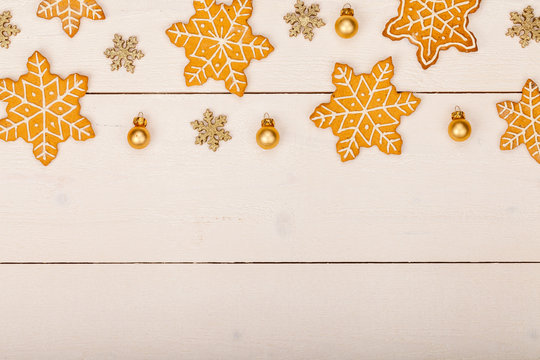 christmas homemade gingerbread cookies on wooden table, top view, copy space