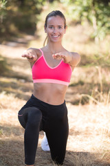 sportswoman exercising out in nature on a sunny day