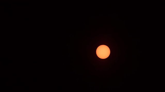 Sun, With Few Sunspots In Solar Minimum, View Through Solar Filter, Moving Through Clouds In Sky