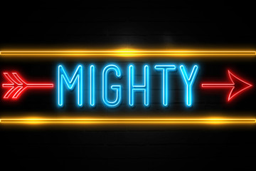 Fototapeta premium Mighty - fluorescent Neon Sign on brickwall Front view