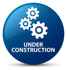 Under construction (gears icon) blue round button