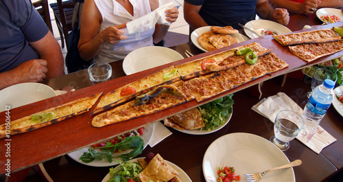 "Turkish Pide pizza are served on long planks in Antalya ...