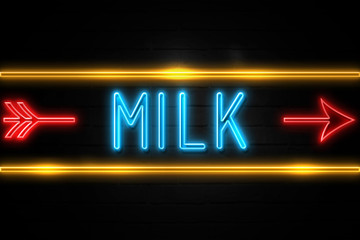 Milk  - fluorescent Neon Sign on brickwall Front view