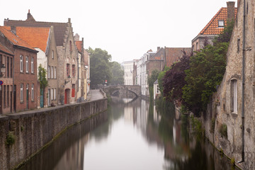 Bruges Canal On Misty Day