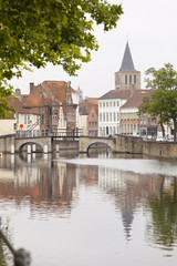 Fototapeta na wymiar Canal Bridge At Potterierei In Bruges
