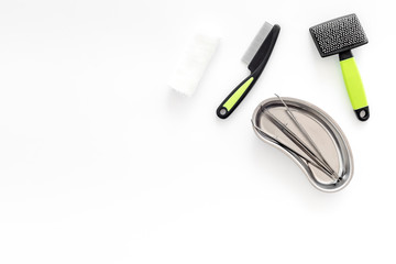 grooming set with pets cure tools and brushes on white background top view mockup
