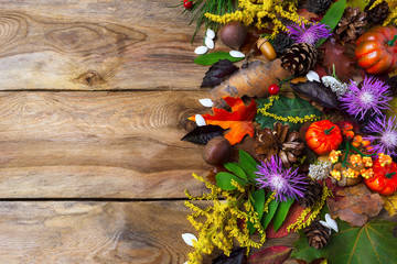 Fall greeting with purple autumn flowers on wooden table
