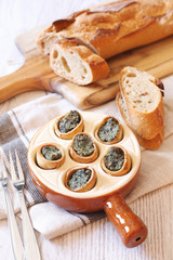  French cuisine: snails and baguette