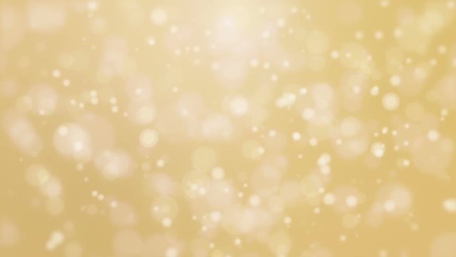 Christmas animated bokeh background with glowing light particle floating against golden backdrop.