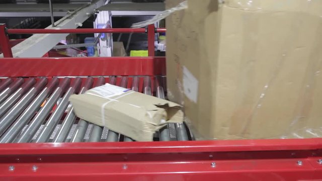 Boxes at Conveyor Rollers in Distribution Warehouse