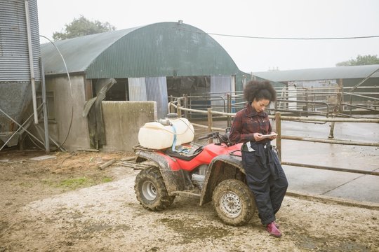 Female farmer using digital tablet in field
