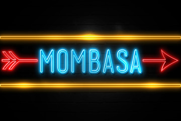 Fototapeta premium Mombasa - fluorescent Neon Sign on brickwall Front view