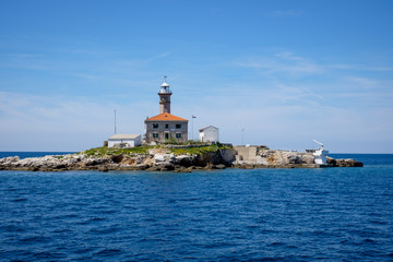 Fototapeta na wymiar Lighthouse off the coast of Rovinj Croatia