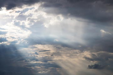 Cloudy with light shining.