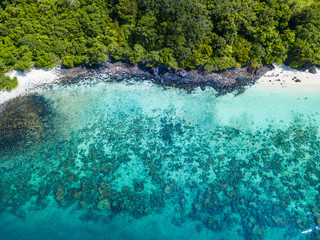Aerial view or top view of tropical island beach with clear water at Coral Island, Koh Hey, Phuket