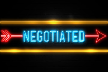 Negotiated  - fluorescent Neon Sign on brickwall Front view