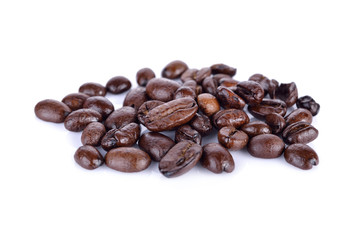pile of roasted coffee beans arabica strong blend on white background