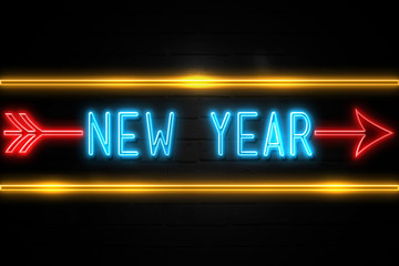 Obraz premium New Year - fluorescent Neon Sign on brickwall Front view