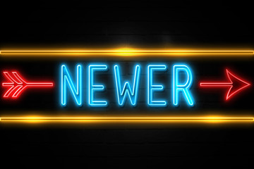 Obraz premium Newer - fluorescent Neon Sign on brickwall Front view