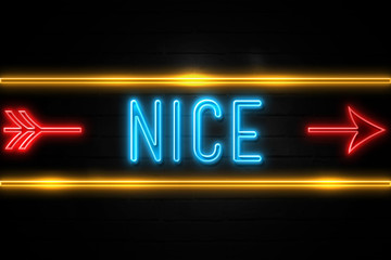 Obraz premium Nice - fluorescent Neon Sign on brickwall Front view