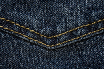 detail of seam on the back pocket of the denim trousers