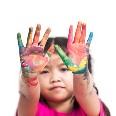 Cute asian child girl with hands painted in colorful paint on white background
