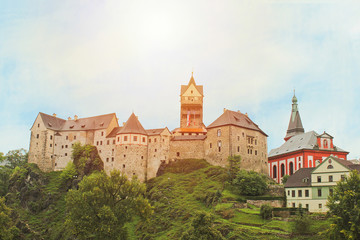 Fototapeta na wymiar Castle Loket near city Karlovy Vary with sun