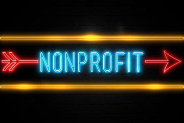 Nonprofit  - fluorescent Neon Sign on brickwall Front view