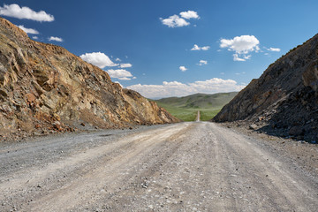 View on road, mountains and sky with clouds from  the Obotyn-Daba mountain pass
