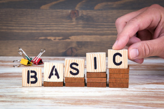 Basic concept. Wooden letters on the office desk, informative and communication background.