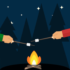 Fry marshmallows over a fire. The hand holds a wand with a marshmallow