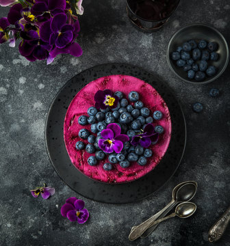 no baked blueberry mousse cake on dark background, selective focus,