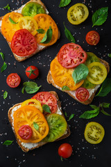 colorful tomatoes sandwich with basil