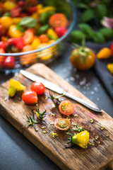 Chopped tomatoes on serving wooden board