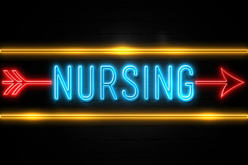 Nursing  - fluorescent Neon Sign on brickwall Front view