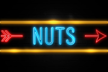 Nuts  - fluorescent Neon Sign on brickwall Front view