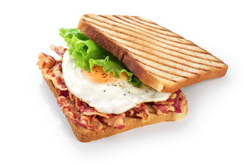 Sandwich with bacon, fried egg and  lettuce isolated on white background.
