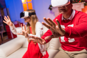 father and daughter in vr headsets